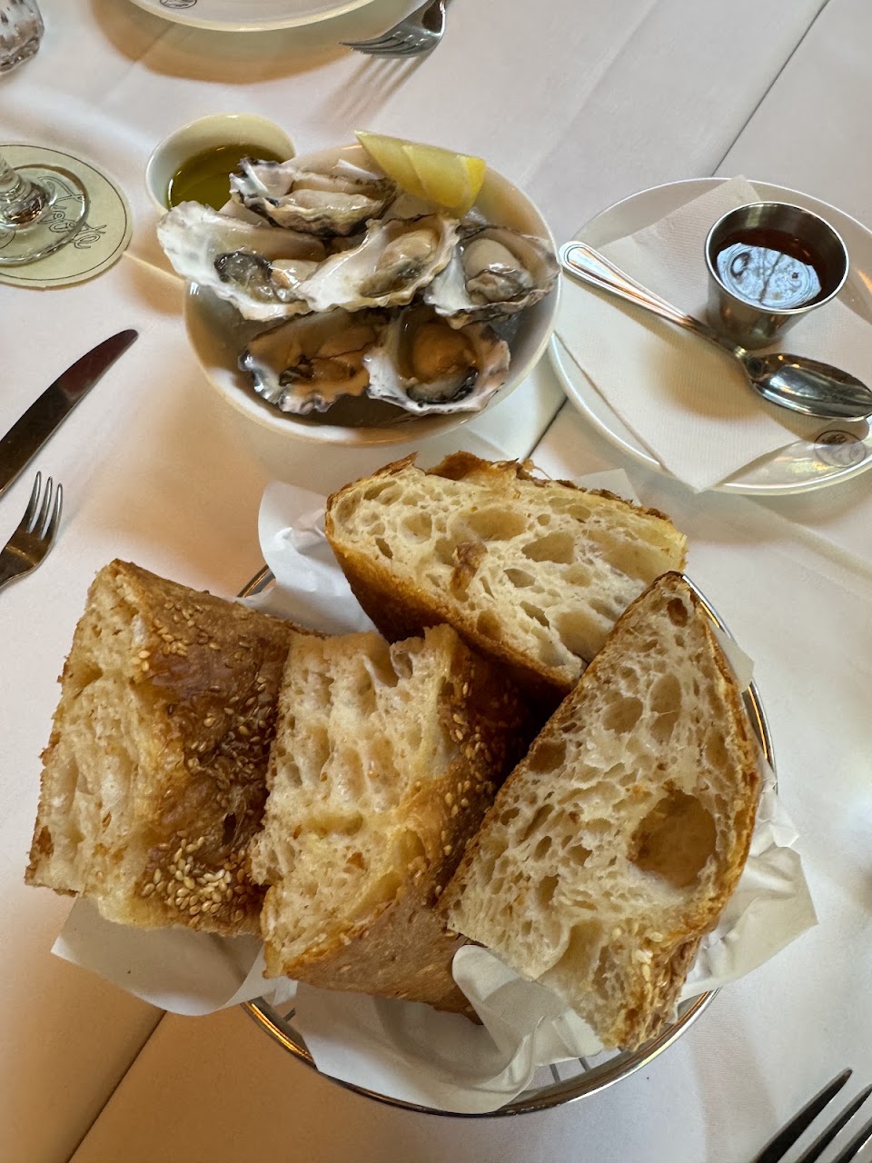 Sydney rock oysters and sesame focaccia on a Le Foote table