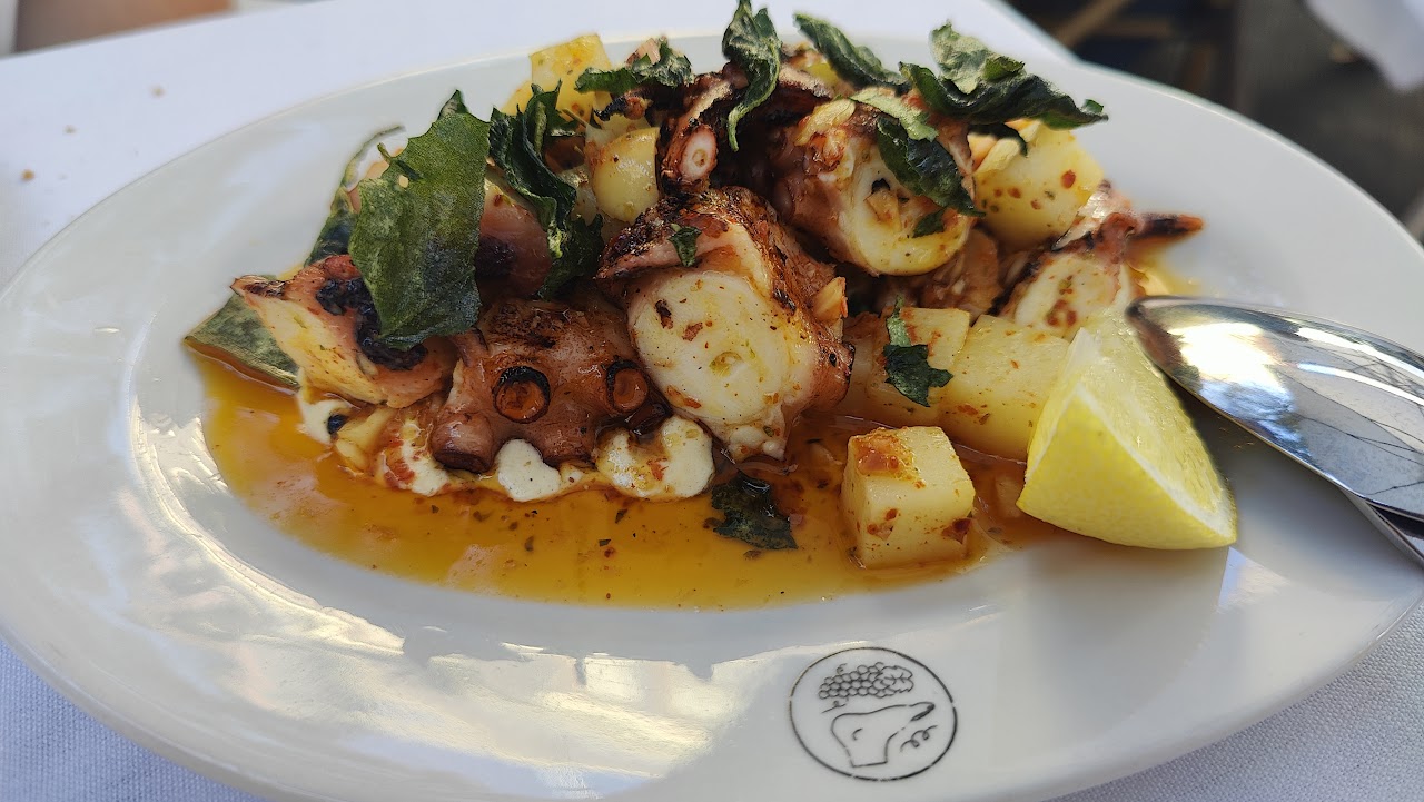 Octopus with potatoes and lemon on a Le Foote plate